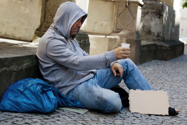 homeless man beggin on the street